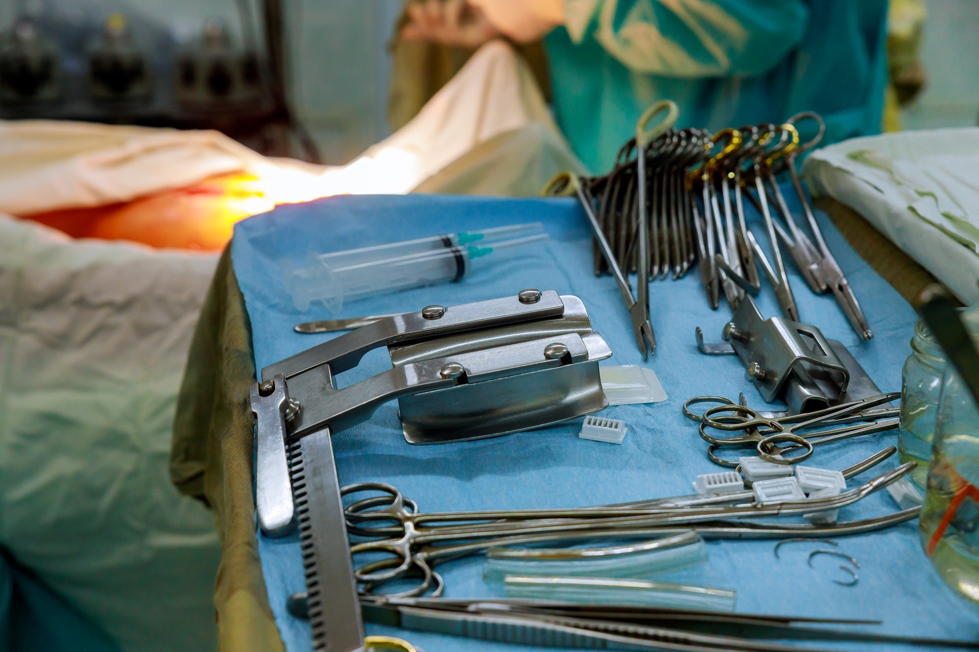 The surgeon in the instruments of surgery in operating room of medical stainless equipment